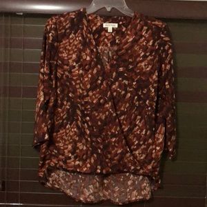 3/4 length sleeve blouse, a little longer in the back 100% polyester